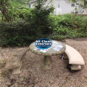 before and after cleaning of two cement benches and a table which was pressure washed in Monmouth County, NJ