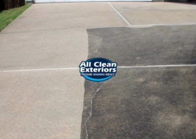 a concrete driveway being pressure washed in Monmouth County, NJ