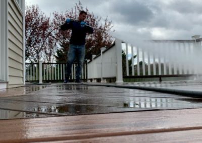 employee power washing a Trex wood deck in Monmouth County, NJ