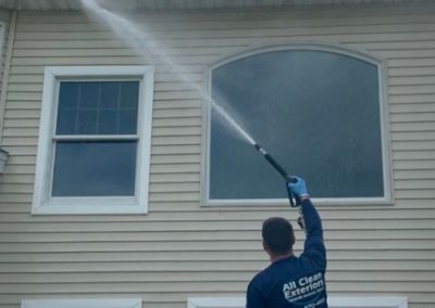 employee soft wash power washing vinyl siding in Fair Haven, NJ