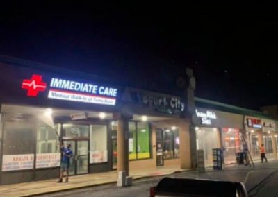 employees power washing a commerical strip mall in Toms River, NJ