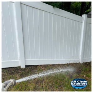Cleaning a white vinyl fence